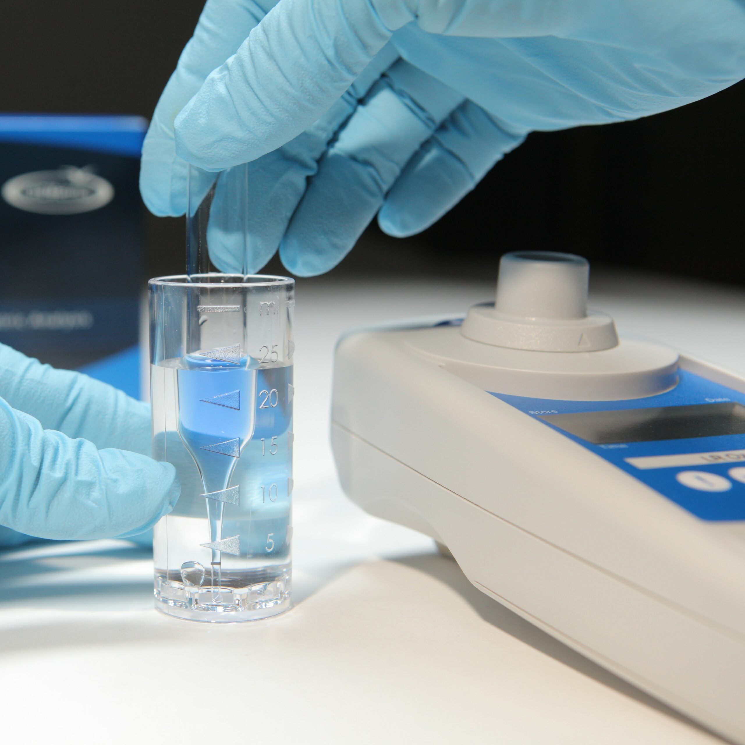 water being tested for ozone with a CHEMetrics K-7433 ampoule.